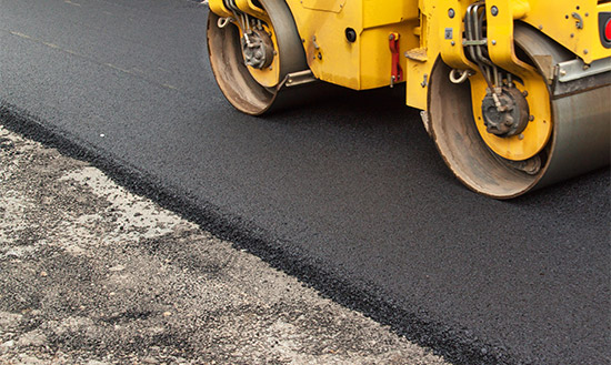 A road roller paving asphalt